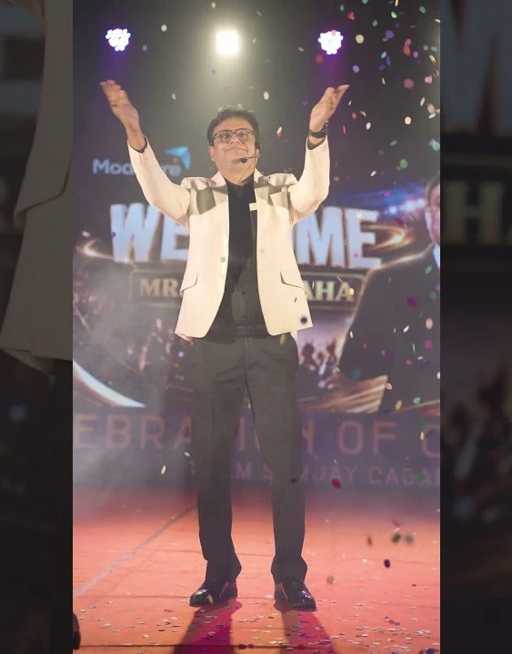 Raja Saha celebrating on stage at Kolkata Mega Event